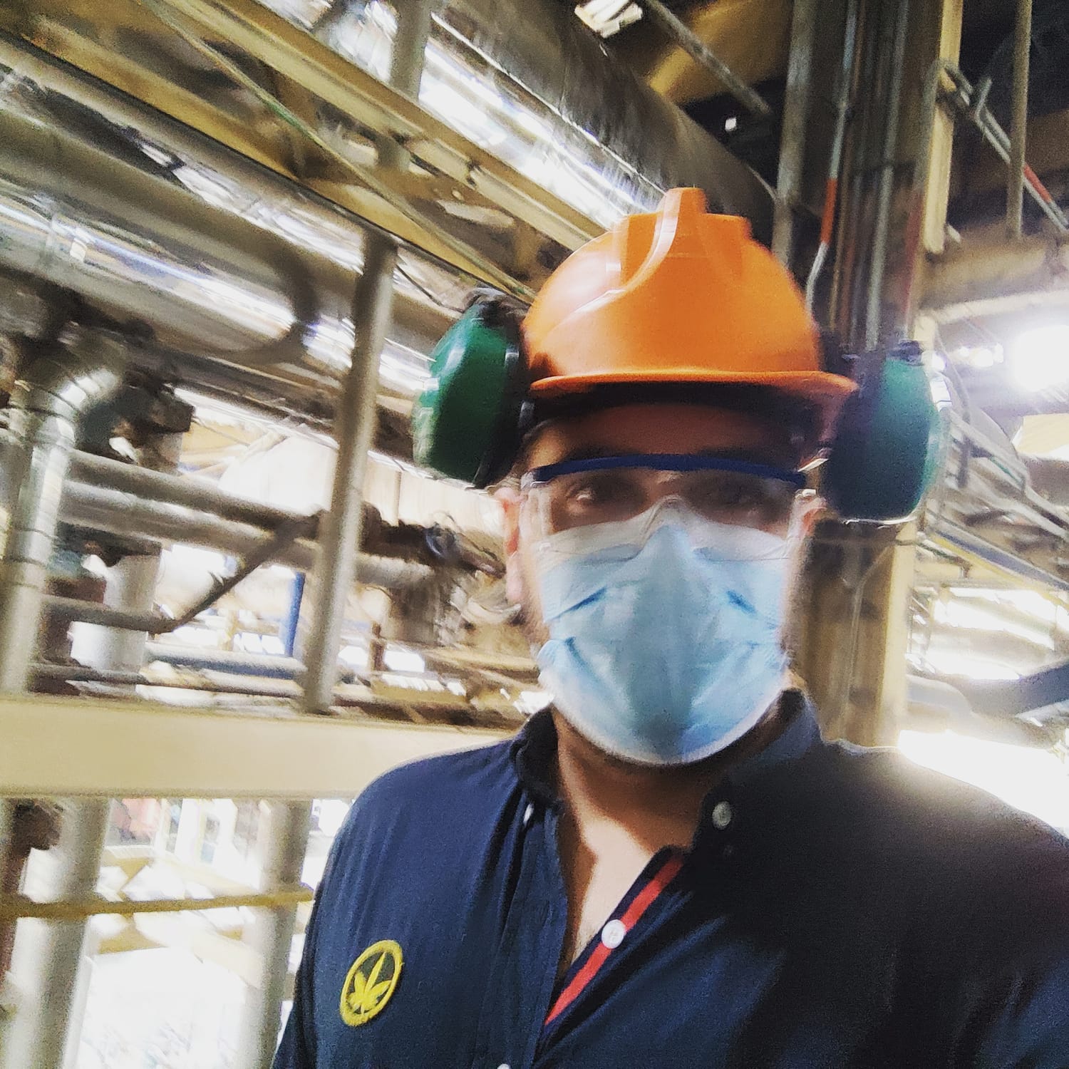 Working in PPE inside an industrial plant.
